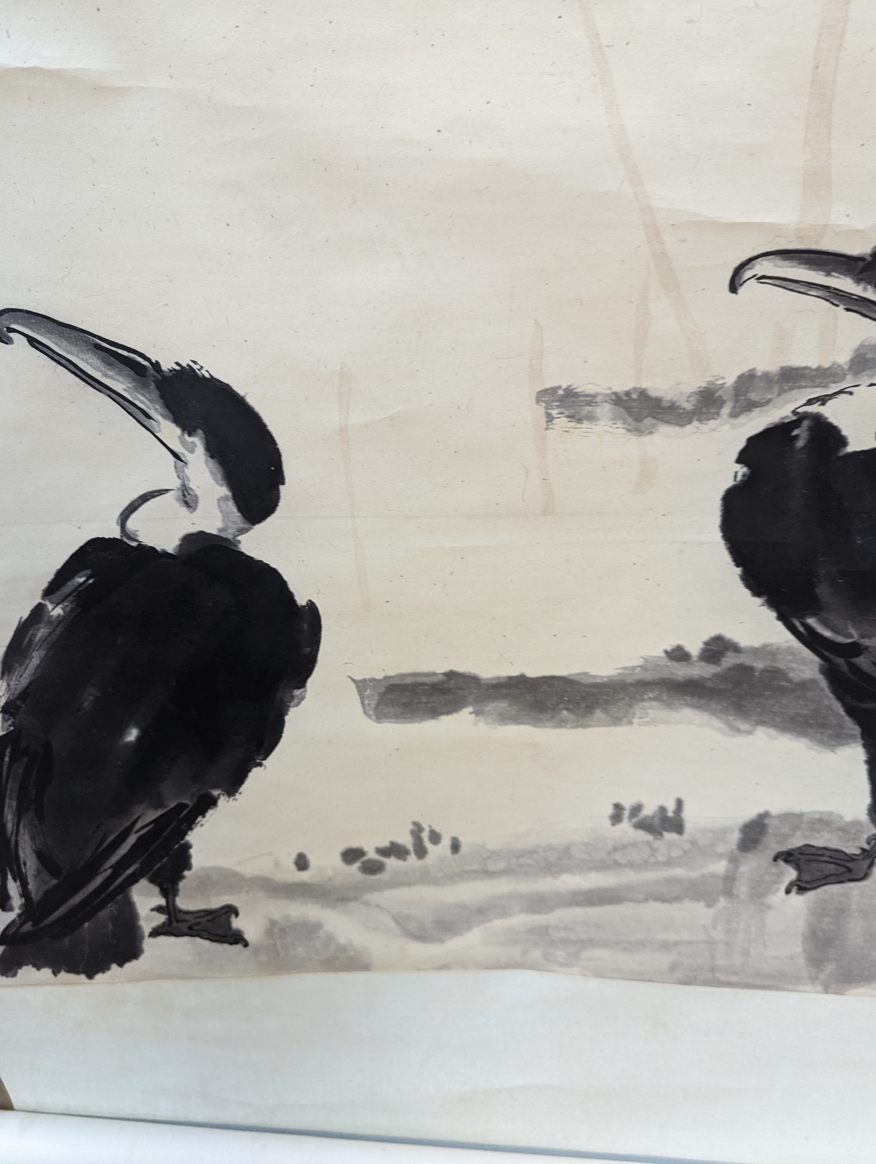 Two mid 20th century Japanese watercolour on paper scroll paintings, Boatman in a landscape, 79.5 x 113cm, and Cormorants on a bank, 103 x 106cm